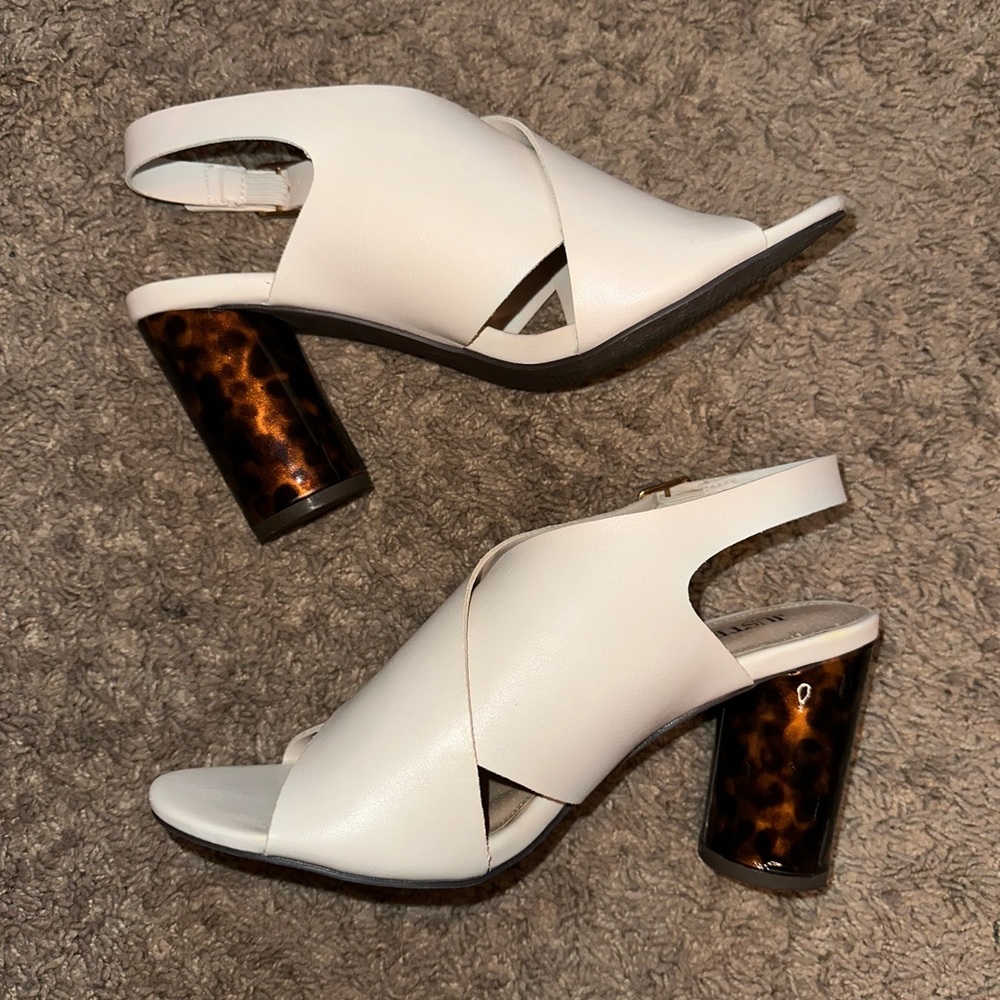 JustFab white heels with black and brown accent heel